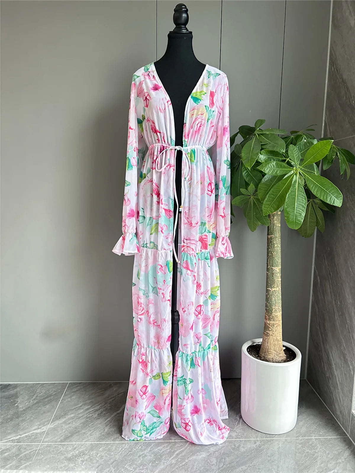 Flowers Printed Long Sleeve Tunic Beach Cover Up with floral pattern and chic belt detail, Polyester material, combines style and comfort, offers elegance and sun protection for women.