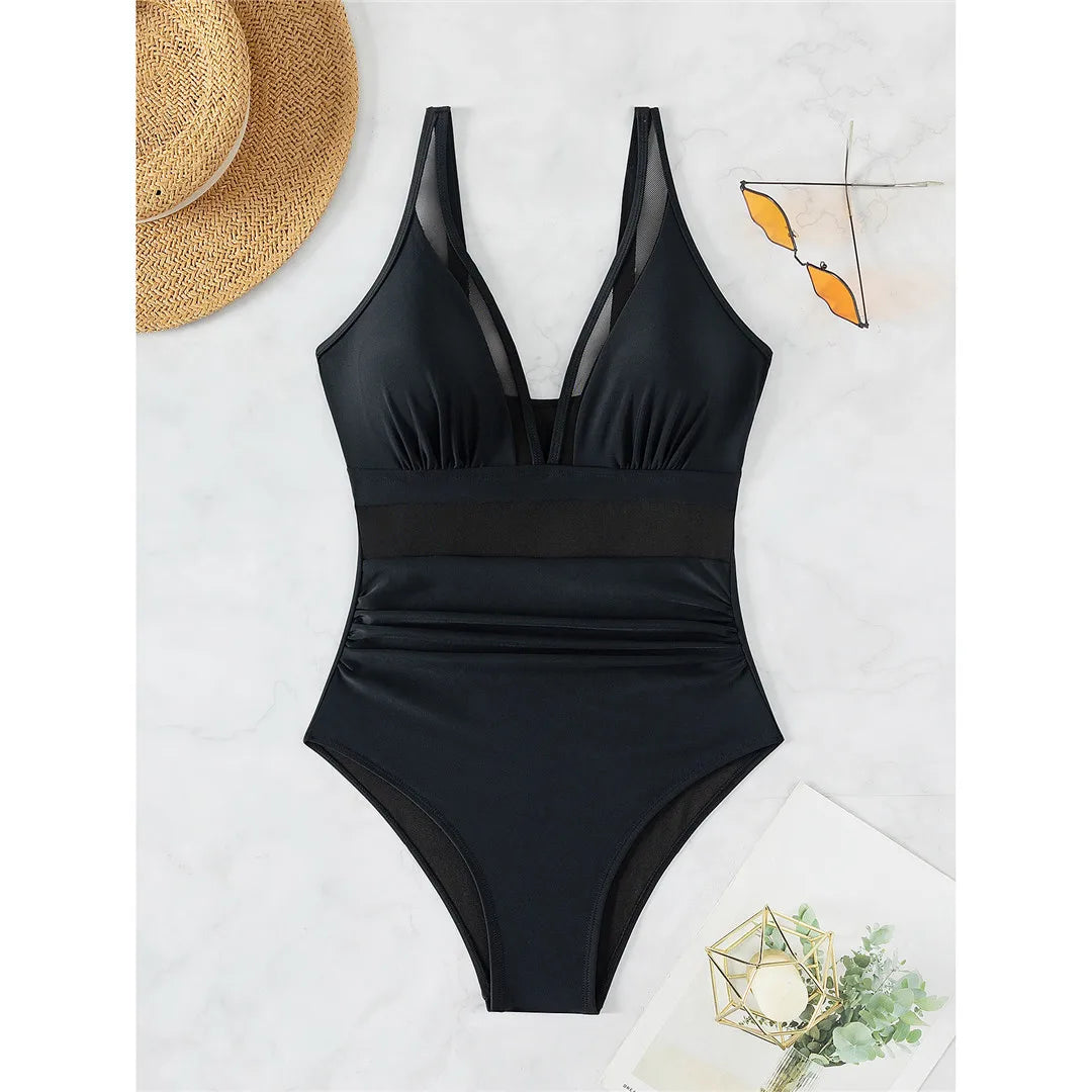 Mesh Sheer V Neck Leopard Printed One Piece Swimsuit erhältlich in den Größen S bis XL. Dieser einteilige Badeanzug oder Monokini aus Nylon und Elasthan ist mit durchsichtigen Mesh-Details und einem auffälligen Leopardenprint versehen. Mit seinem tiefen V-Ausschnitt und der schmeichelhaften Silhouette ist er perfekt, um am Pool oder am Strand einen auffälligen Eindruck zu hinterlassen. Erhältlich in Schwarz, Tiefblau, Pink, Rot, Weiß, Dunkelgrün, Grün, Blätter, Leopard und Multicolor.