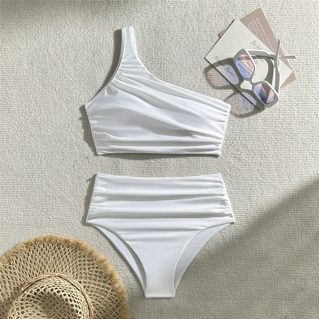 Wrinkled one-shoulder high waist bikini set, distinctive design, polyester spandex blend, wire-free support, women's solid two-piece swimwear, modern elegance and comfort.