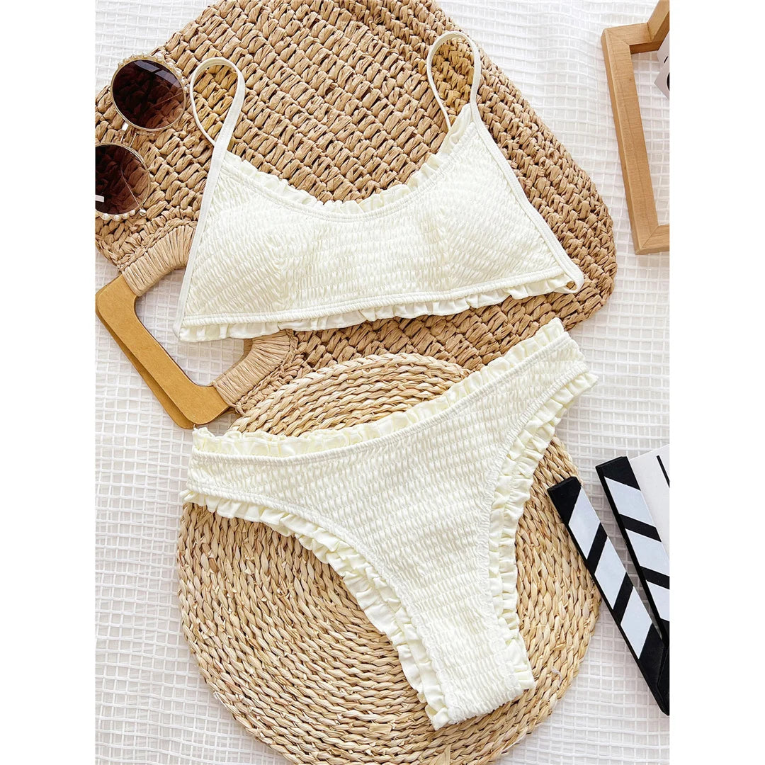 Frilled Ruffled Mid Waist Bikini set with charming frills and ruffles, Polyester Spandex material, solid pattern, wire-free, mid waist design, offers a unique and stylish twist for women.