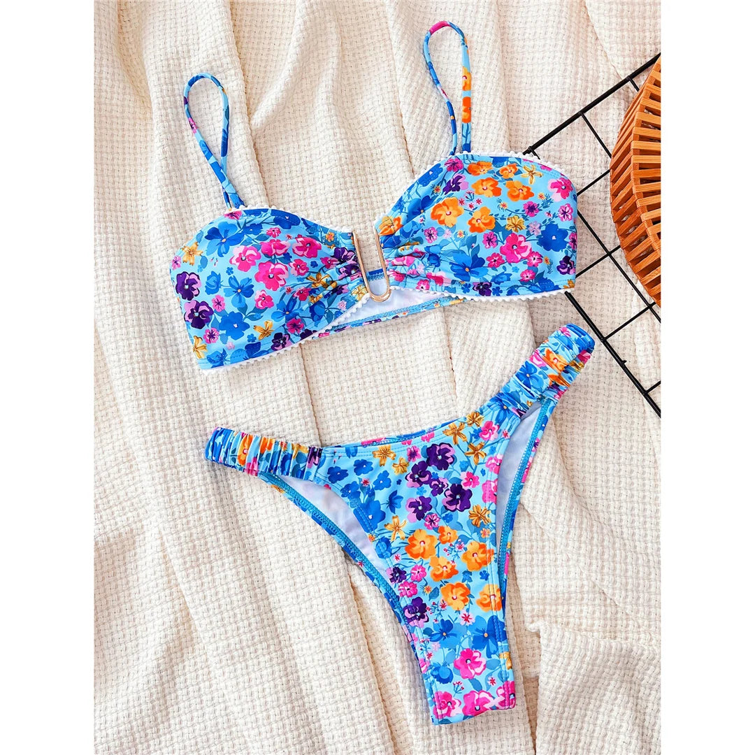 Chic U-neck bikini set with floral print and wrinkled design, wire free and low waist, polyester and spandex material, comfortable two-piece swimwear for women.