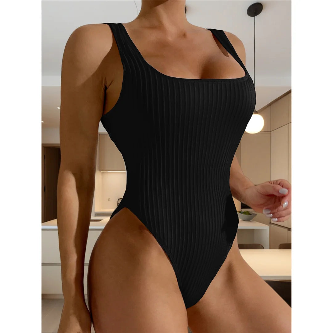 Ribbed cut-out backless one-piece swimsuit, strappy high-leg design, adjustable triangle top, monochrome solid pattern, polyester spandex blend, women's daring and elegant swimwear.