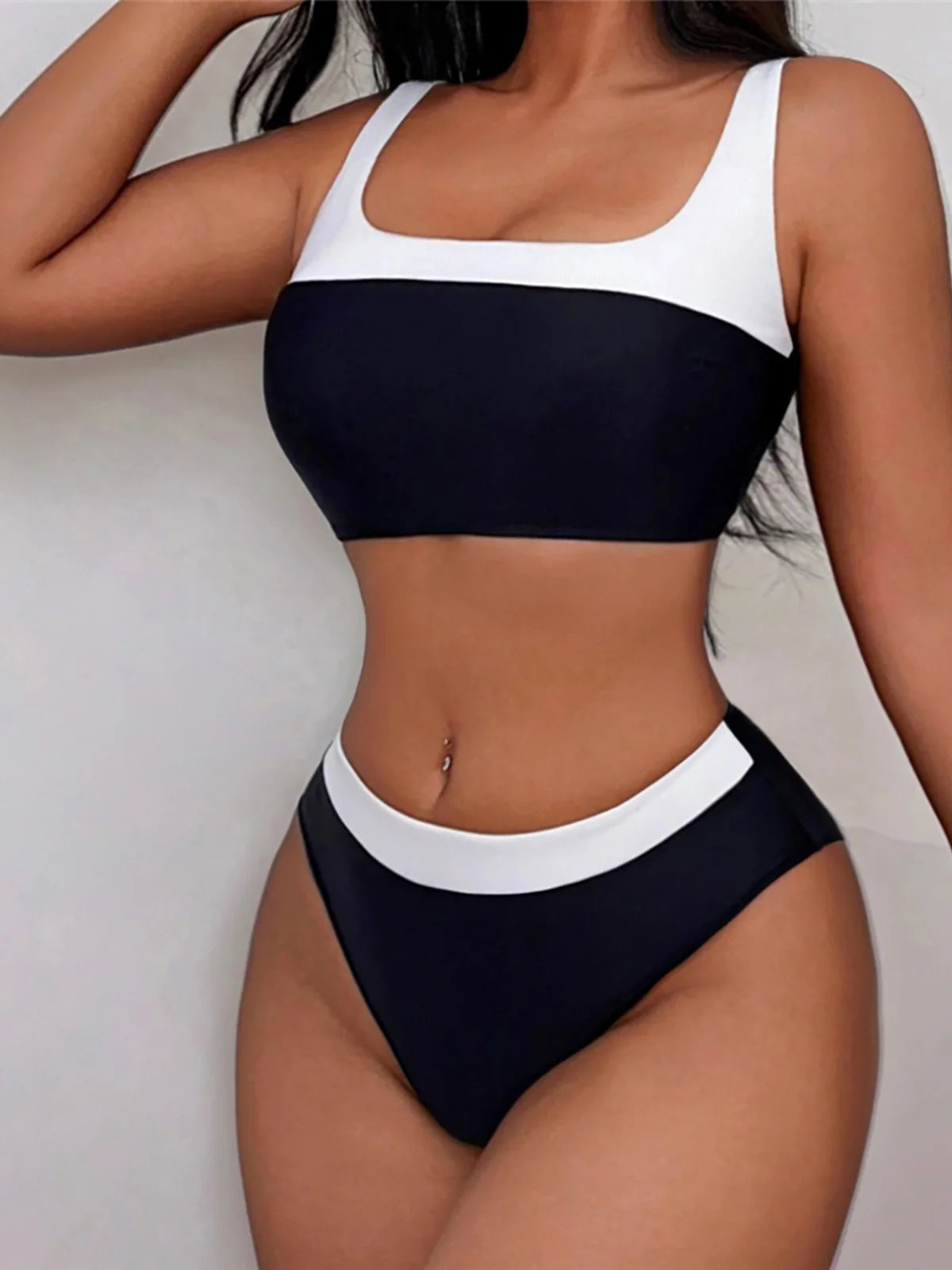 Splicing mid-waist bikini set, high-leg design, patchwork pattern, polyester spandex blend, wire-free support, women's two-piece swimwear, trendy and fashionable look.