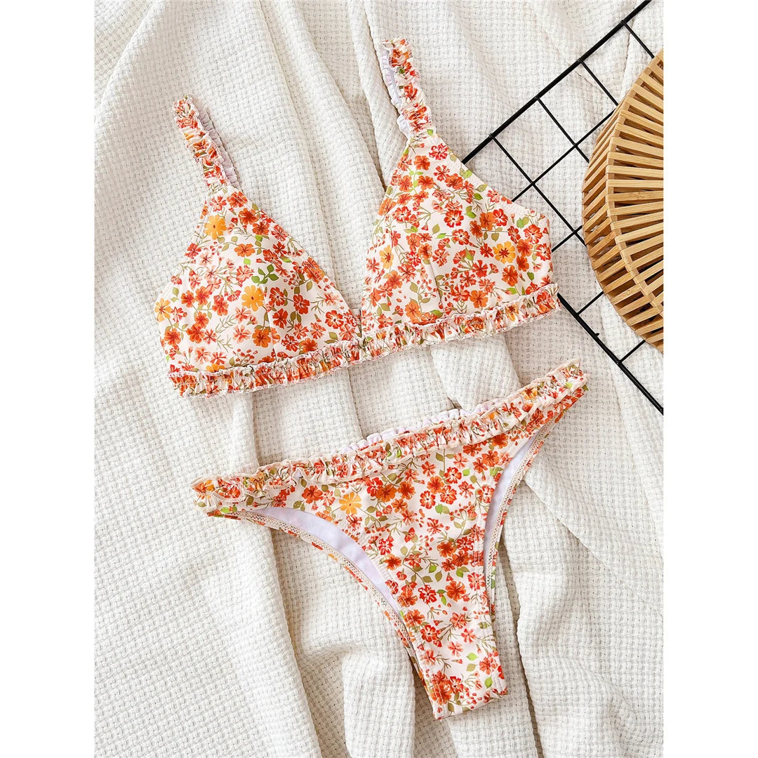 Flowers printed ruffled Brazilian bikini set, vibrant floral design, polyester spandex blend, wire-free support, low waist, women's two-piece swimwear, charming and feminine style.