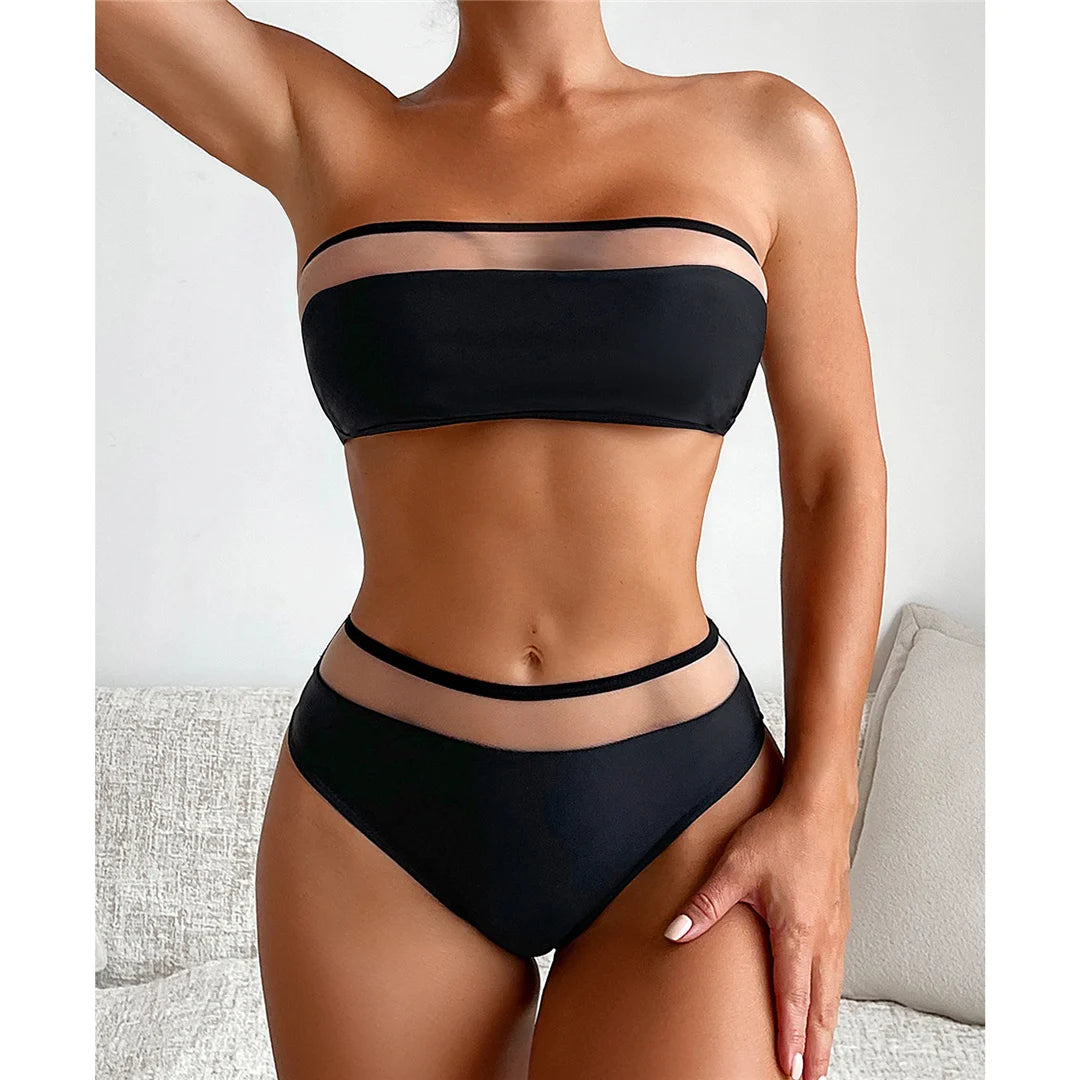 Bandeau Splicing Mesh Sheer Two-Piece Bikini Set for women aged 18-35. Features a blend of solid and patchwork patterns made from Nylon and Spandex. This sleek swimsuit set offers a wire-free design and includes a bandeau top with mesh accents and mid-waist bikini bottoms. Available in a chic Black color and in sizes S, M, and L. Currently in stock with free shipping available.